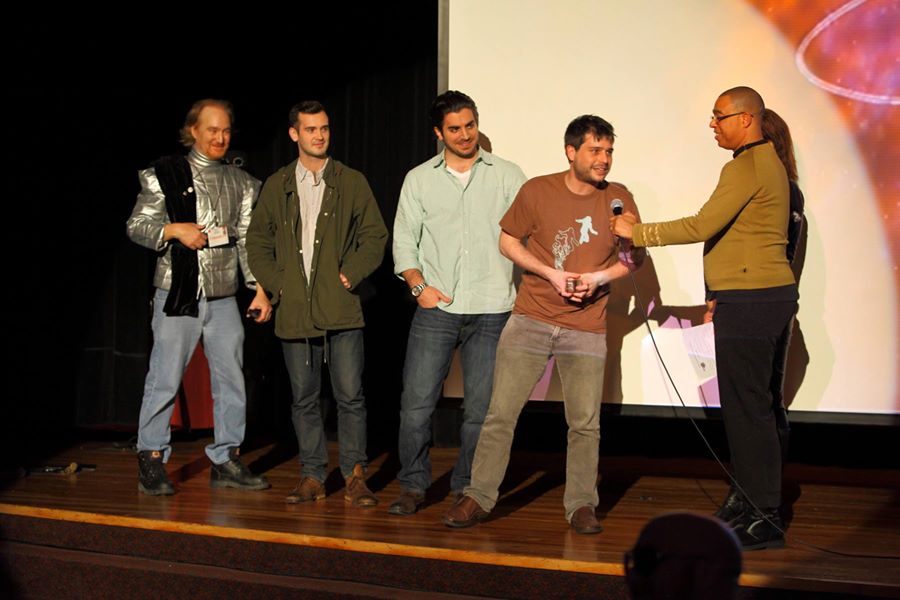HELIO's Teddy Cecil, Nick Cofino and Brett Miller of Shadow Council Productions accepting the award for Best Sci-Fi Short